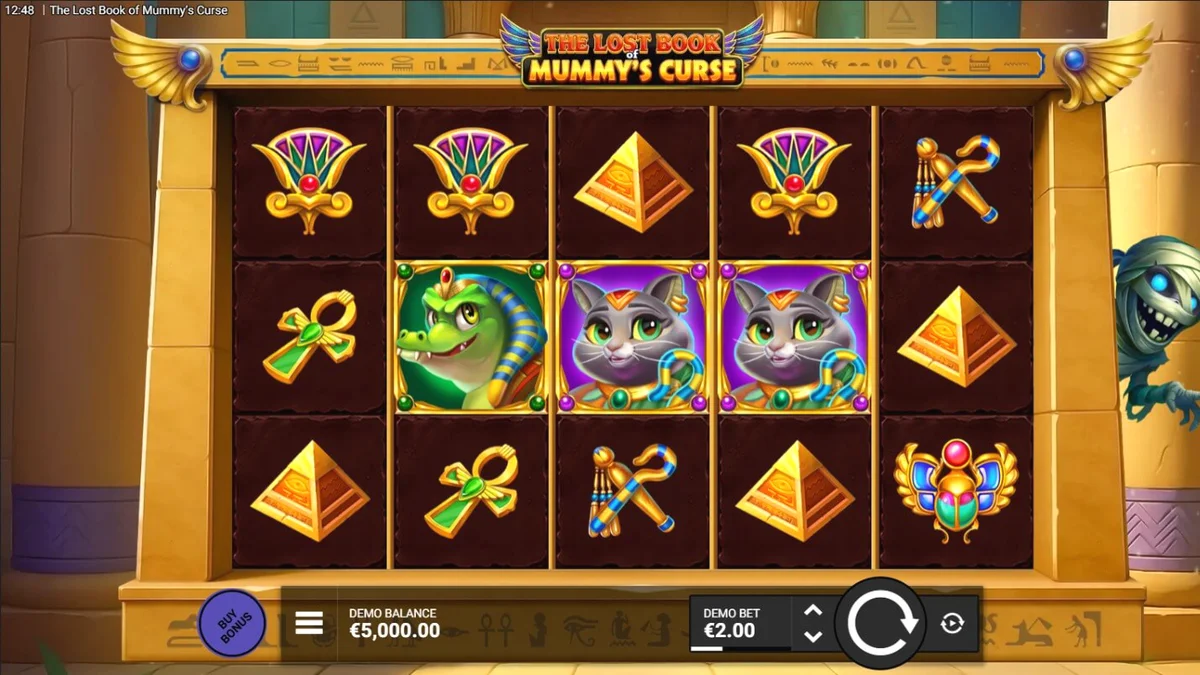 Tampilan visual slot The Lost Book of Mummy’s Curse dengan tema kartun Mesir yang cerah